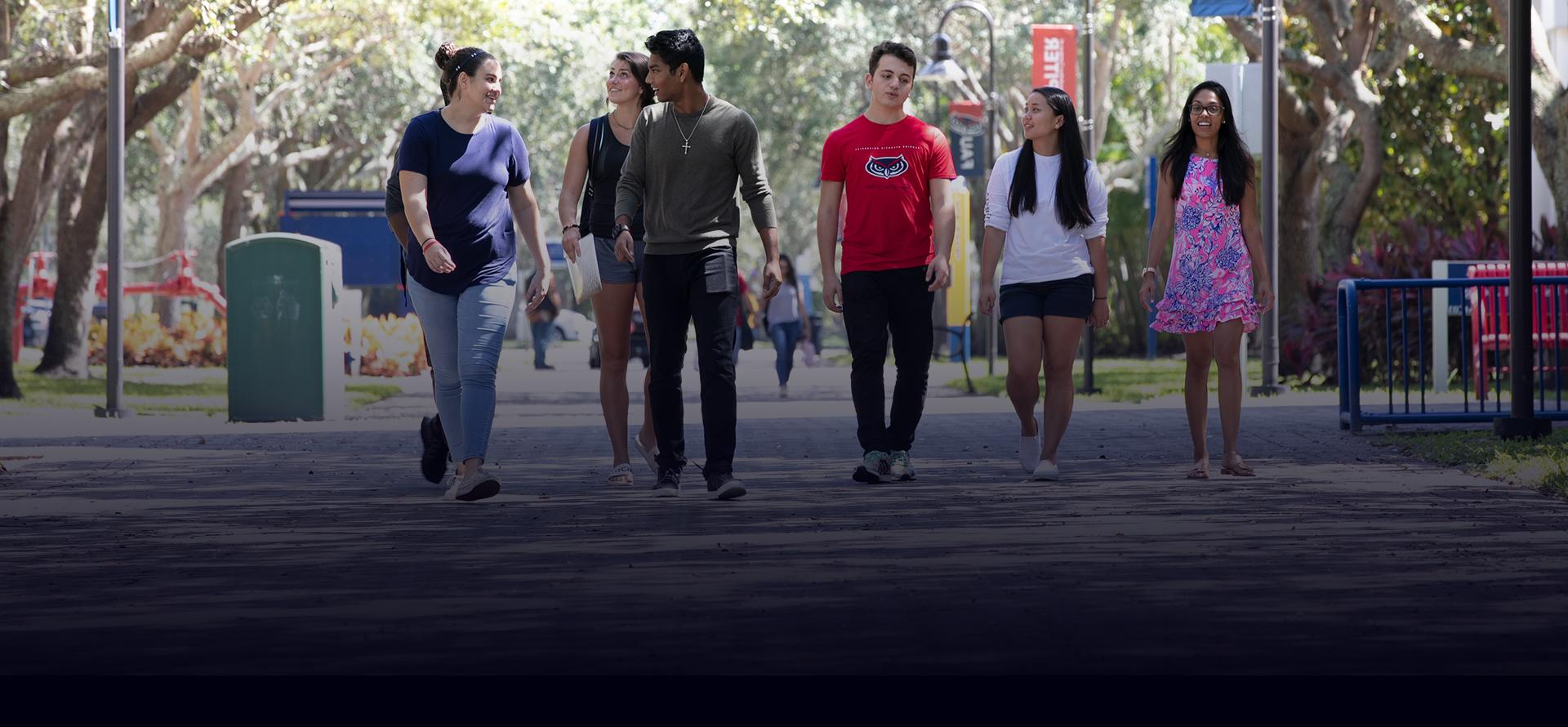 students walking on campus sidewalk